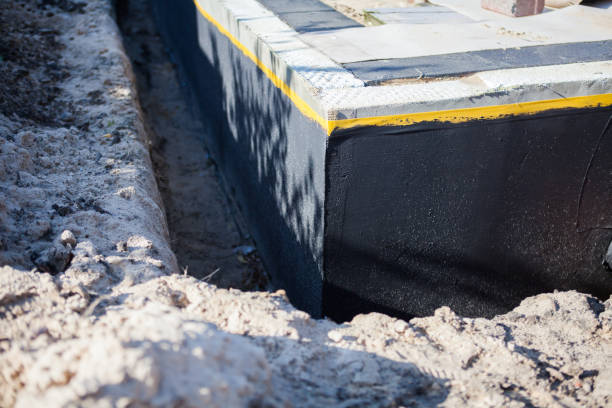 Professional Waterproofing technician working in Evart, MI